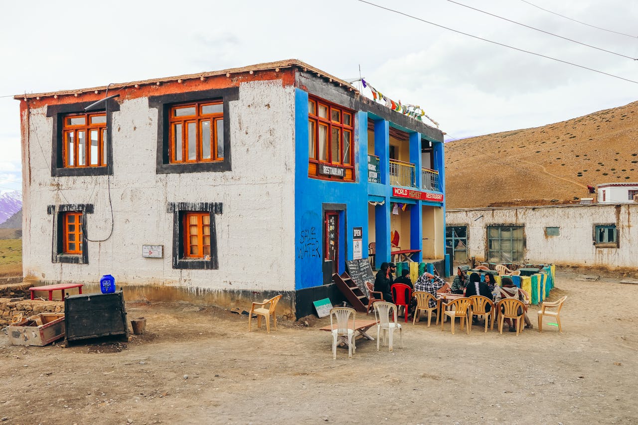 A vibrant café in Komic Village, Himachal Pradesh, set amidst the serene Spiti Valley landscape.